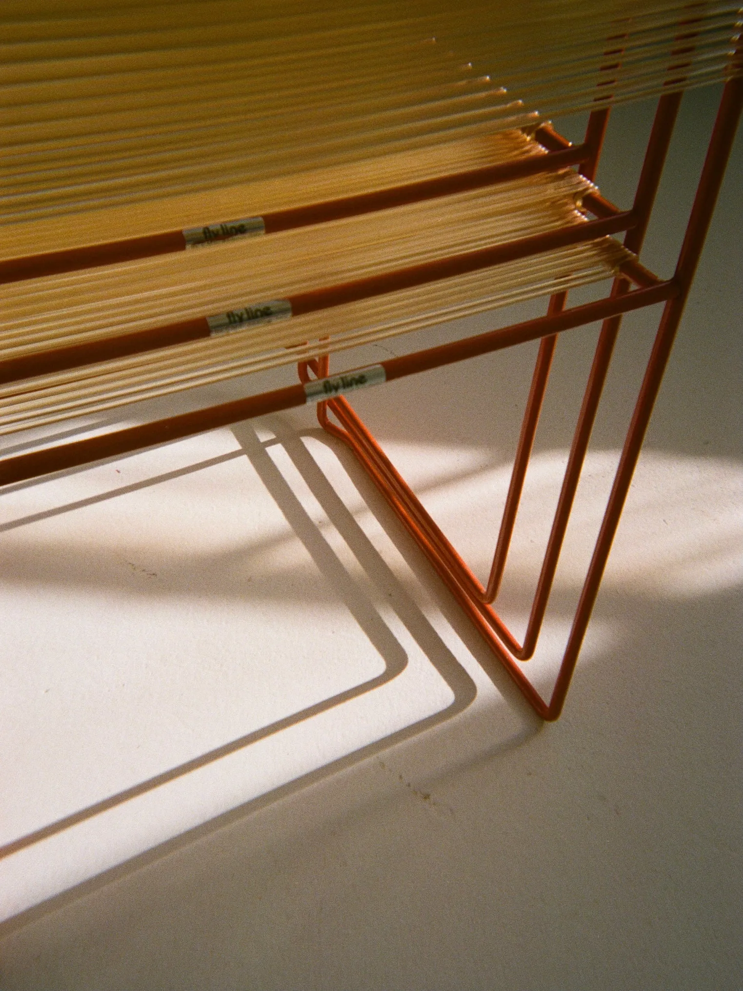 Red spaghetti dinning chairs by Giandomenico Belotti