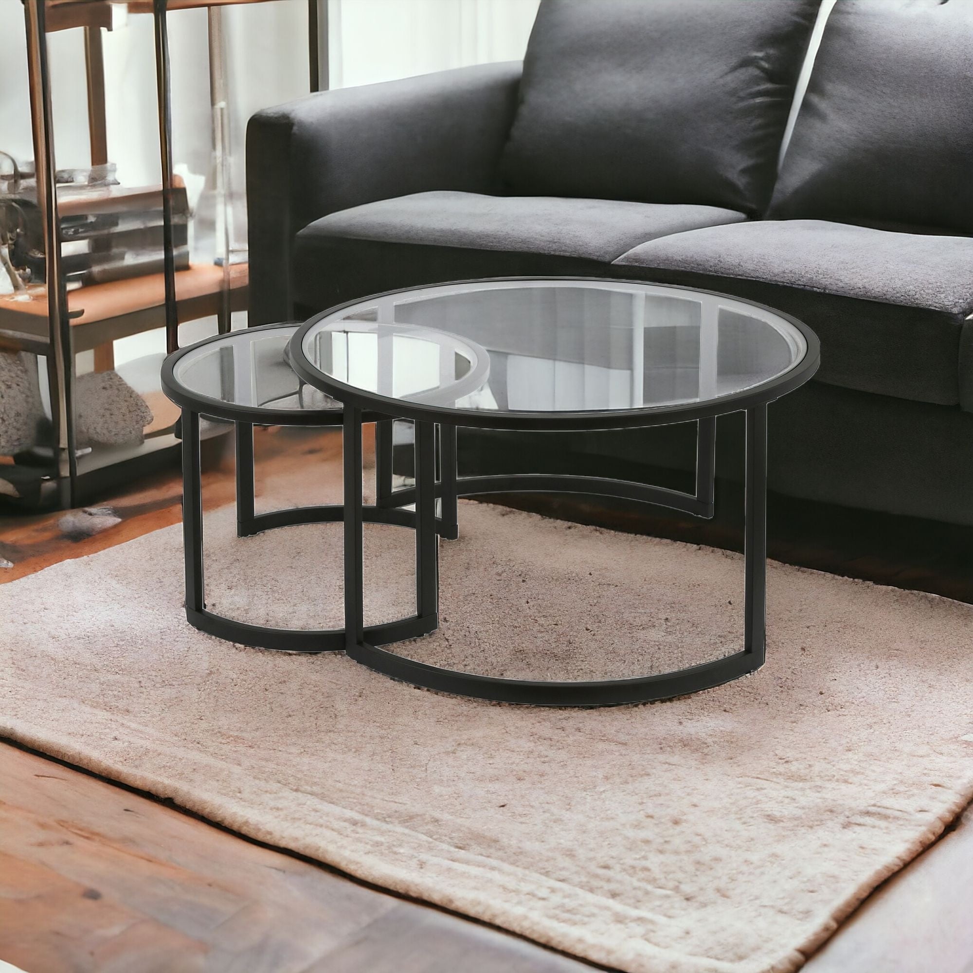 Set of Two 36 Black Glass And Steel Round Nested Coffee Tables