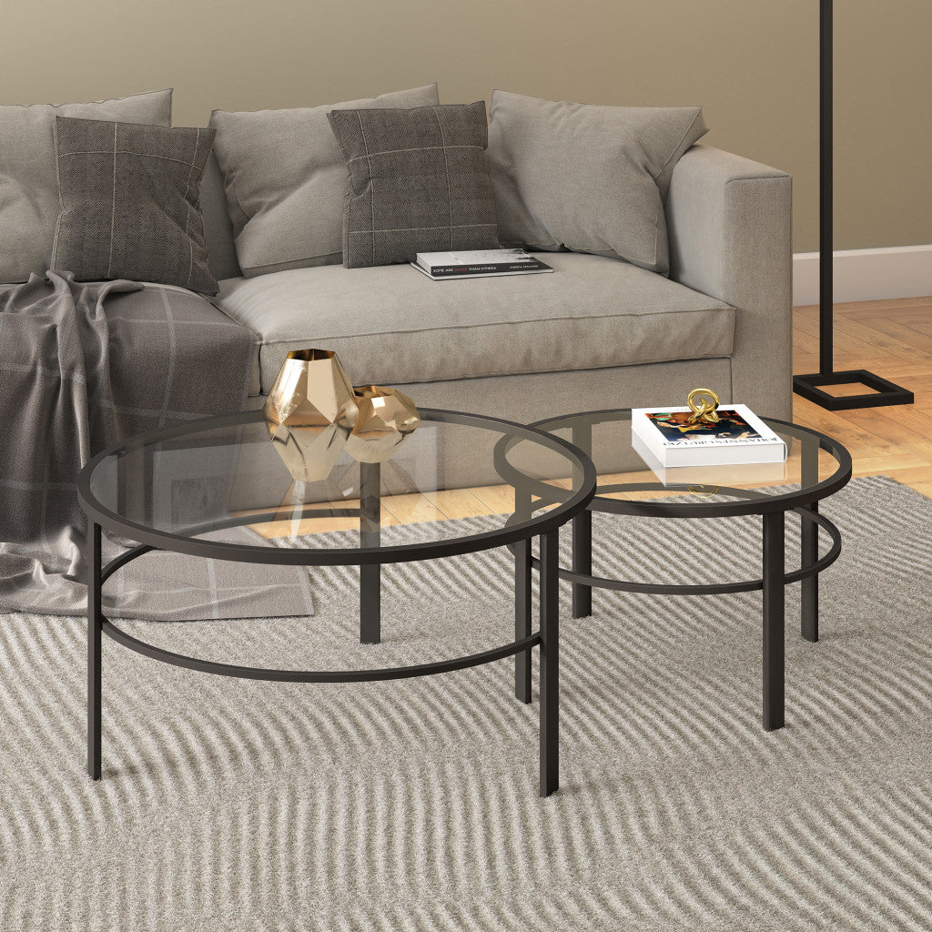 Set of Two 36 Clear And Black Glass And Steel Round Nested Coffee Tables