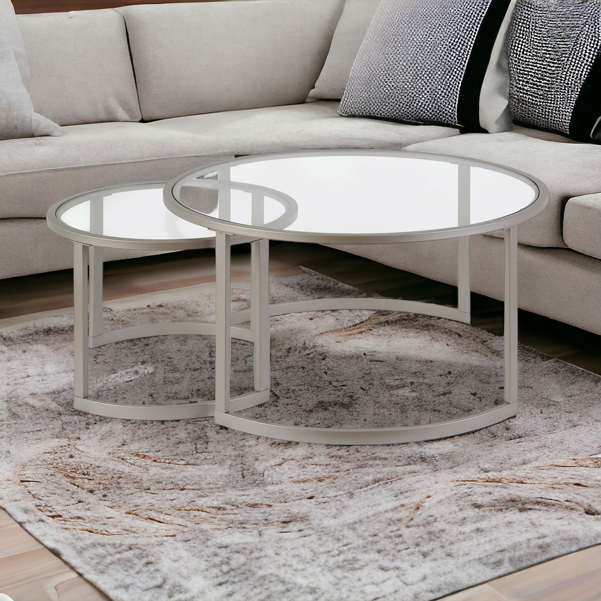 Set of Two 36 Nickel Glass And Steel Round Nested Coffee Tables